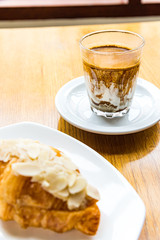 Glass of Nitro Cold Brew Coffee on wood  Table in Coffee Shop, Fresh Drink Compost