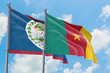 Cameroon and Belize flags waving in the wind against white cloudy blue sky together. Diplomacy concept, international relations.