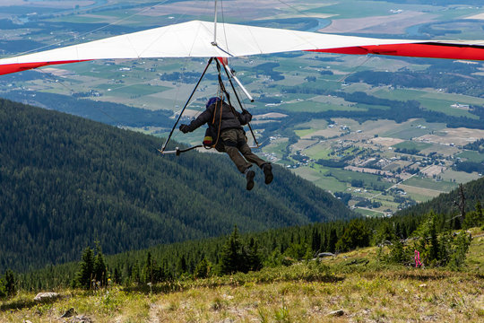 Hang gliding competitions at Kootenay valley mountains, Creston, British Columbia, Canada. Hang-glider launched from in the beautiful sunny day