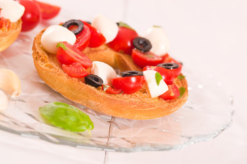 Friselle with tomatoes and mozzarella cheese.
