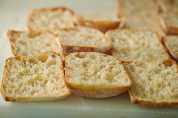 Slicing bread half on cutting board 