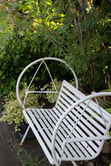 White outdoors seat in the garden
