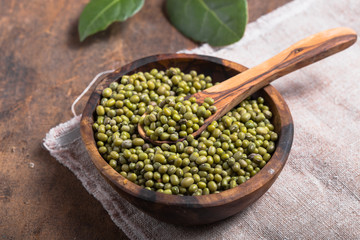 Green mung beans in bowl on wooden  background /  bean seed cereal whole grains