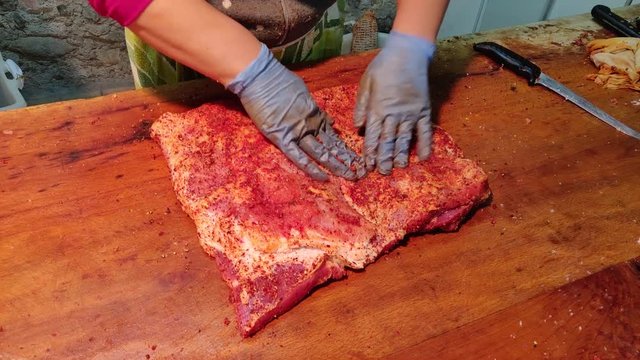 homemade bacon production. Meat flavored with aromas. Capocollo flavored with hot pepper, black pepper and papikra. Video high quality 4k hd.