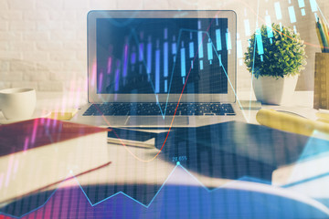 Obraz na płótnie Canvas Forex market chart hologram and personal computer background. Multi exposure. Concept of investment.