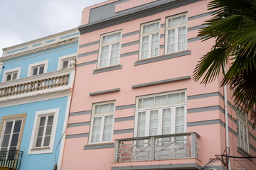 Obraz premium Pastel pink and blue buildings in Lagos, Portugal, in the Algarve region