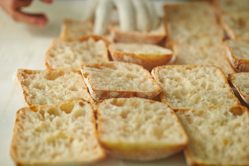 Slicing bread half on cutting board 