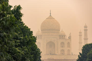 Fototapeta na wymiar The backside of the Taj Mahal in Agra, India on overcast day with smog