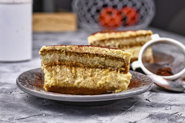 Slice of homemade Tiramisu cream cake dessert