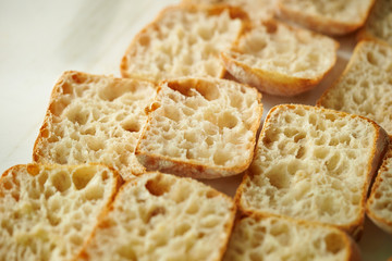 Slicing bread half on cutting board 