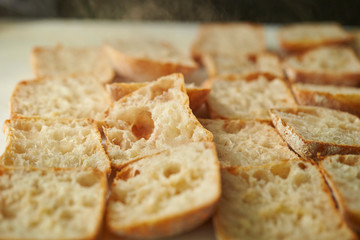 Slicing bread half on cutting board 