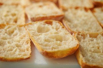 Slicing bread half on cutting board 
