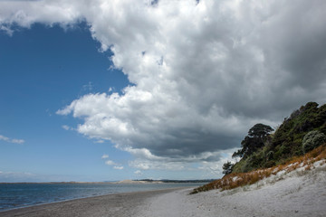 Mangawhai heads. Coast New Zealand. Coast and beach.  Clouds