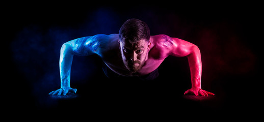 Sporty man doing push ups