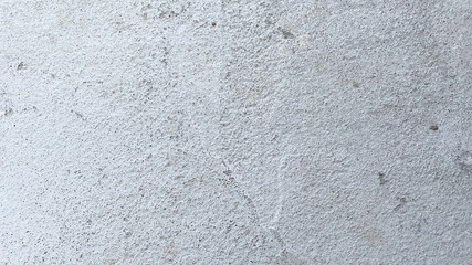 Fototapeta premium Texture of old gray concrete wall for background. Closeup fragment of grunge weathered wall of a building.