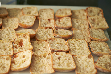 Slicing bread half on cutting board 