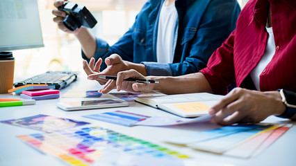 Advertising agency designer creative start-up team discussing ideas in office.