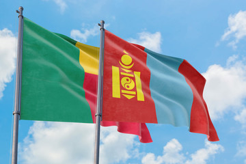 Fototapeta na wymiar Mongolia and Benin flags waving in the wind against white cloudy blue sky together. Diplomacy concept, international relations.
