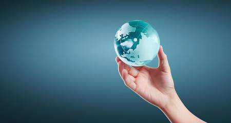Globe ,earth in human hand, holding our planet glowing