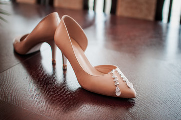 White high heel shoes with earrings