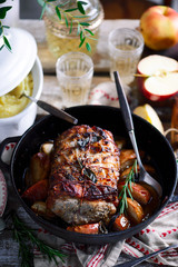 Roasted pork loin with apples.style rustic