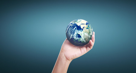 Globe ,earth in human hand, holding our planet glowing