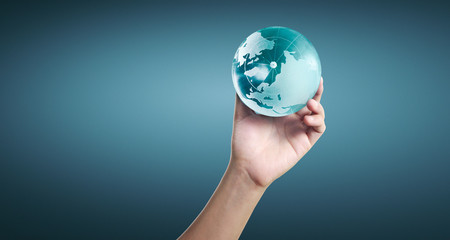 Globe ,earth in human hand, holding our planet glowing