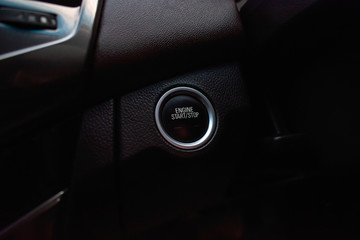 The engine start button in the car