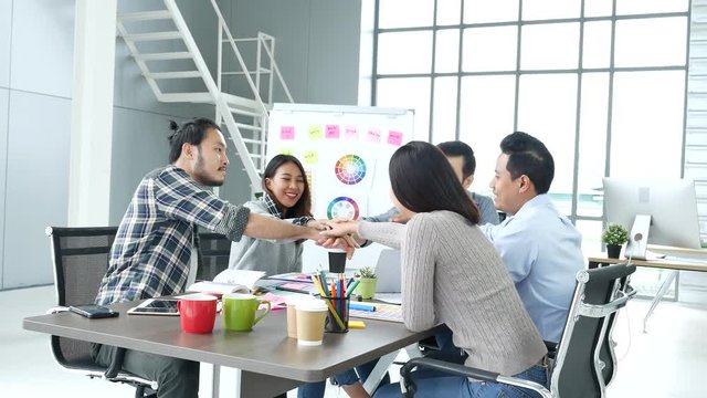 Diverse office team creative agency meeting present design ideas young startup group business people. Casual designer team plan discuss communication business people working together conference room