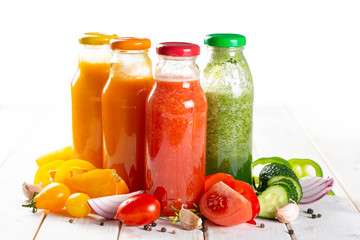 Selection of colorful gazpachoes on white wood background, copy space