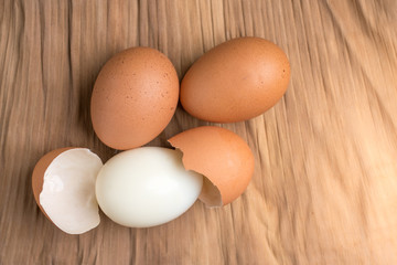 Eggshell and chicken eggs on the ground, brown banana leaves in the studio.Boiled eggs are a food for everyone's health.