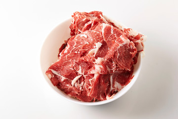 Frozen beef in white bowl 