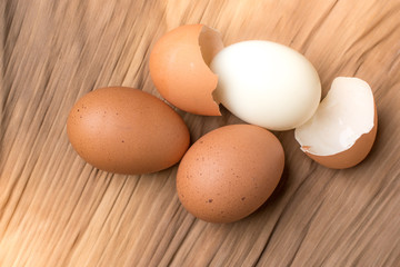 Eggshell and chicken eggs on the ground, brown banana leaves in the studio.Boiled eggs are a food for everyone's health.