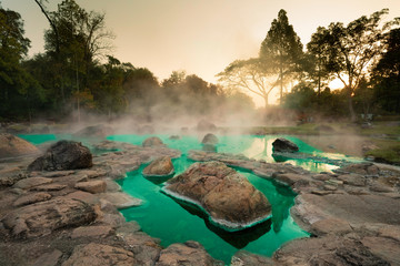 Hot Springs Onsen Natural Bath at National Park Chae Son, Lampang Thailand.In the morning sunrise.Natural hot spring bath surrounded by mountains in northern Thailand..