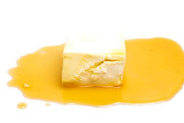 A picture of honey dipper with cheese for current food trend of honey cheese flavour concept.