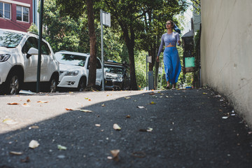 Fototapeta na wymiar woman walking on footpath in Sydney