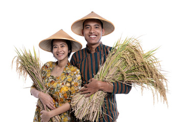 traditional male and female asian farmer with rice paddy grain in hand smiling to camera isolated over white background