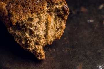 Freshly baked rustic bread on the rustic background. Selective focus. Shallow depth of field.