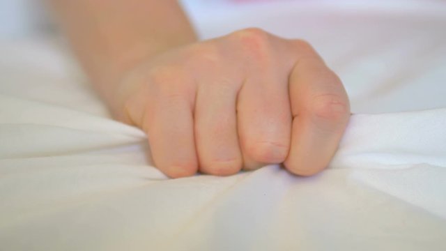 Woman Hand With Sex Orgasm On White Bed in 4K Slow motion 60fps