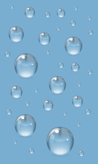 Realistic set of transparent drops of various sizes. Design elements isolated on blue background. Vector illustration