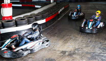 Group of adult male and females driving cars © JackF