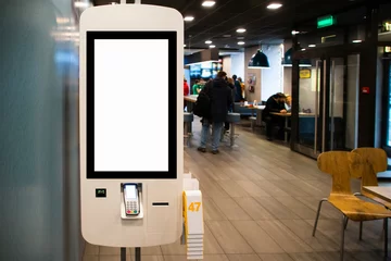 Deurstickers Self-service desk with touch screen in fast food restaurant © scharfsinn86