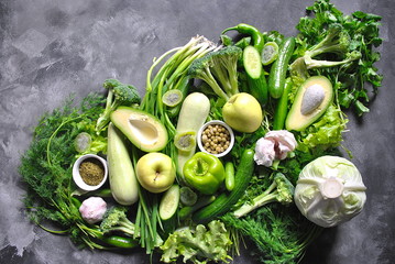 Healthy food background. Concept of healthy Food, Fresh vegetables and fruits. On gray wooden background. Top view. Copy space