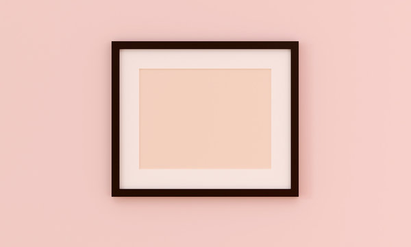 Black picture frame for insert text or image inside on pastel pink color wall. Valentine sweet concept.