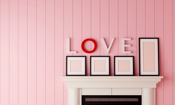 Four black blank picture frame placed on the fireplace with LOVE word on the wall in pastel pink wood room. Valentine sweet concept.
