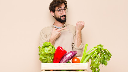 green grocery man looking impatient and angry, pointing at watch, asking for punctuality, wants to...