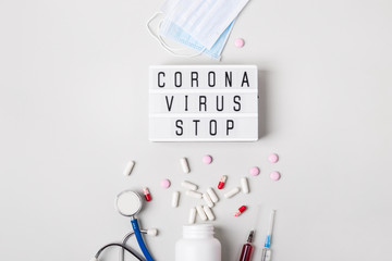 Lightboard with words Coronavirus stop. Severe acute respiratory syndrome. Coronavirus treatment...