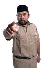 serious face of male with khaki uniform pointing to camera isolated over white background