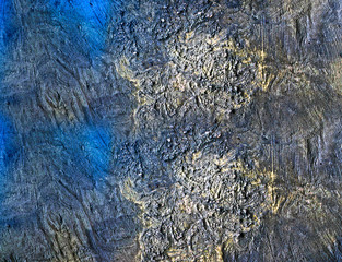 Textured stone wall in blue