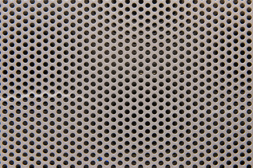 Background metal grid of uniform square holes, close-up texture
